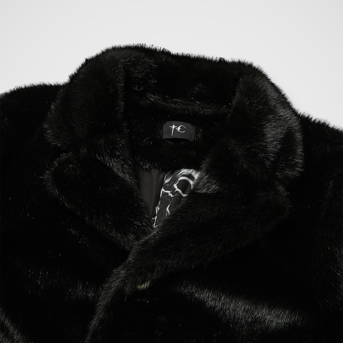 THREE RIDING SKULL FUR COAT