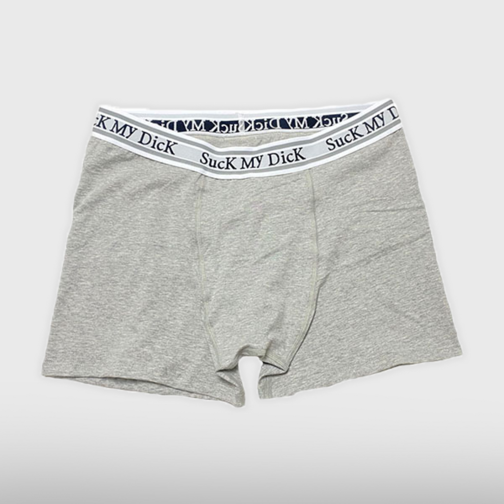 Heather grey Suck My Dick boxer briefs laid flat, front view with a white and grey waistband