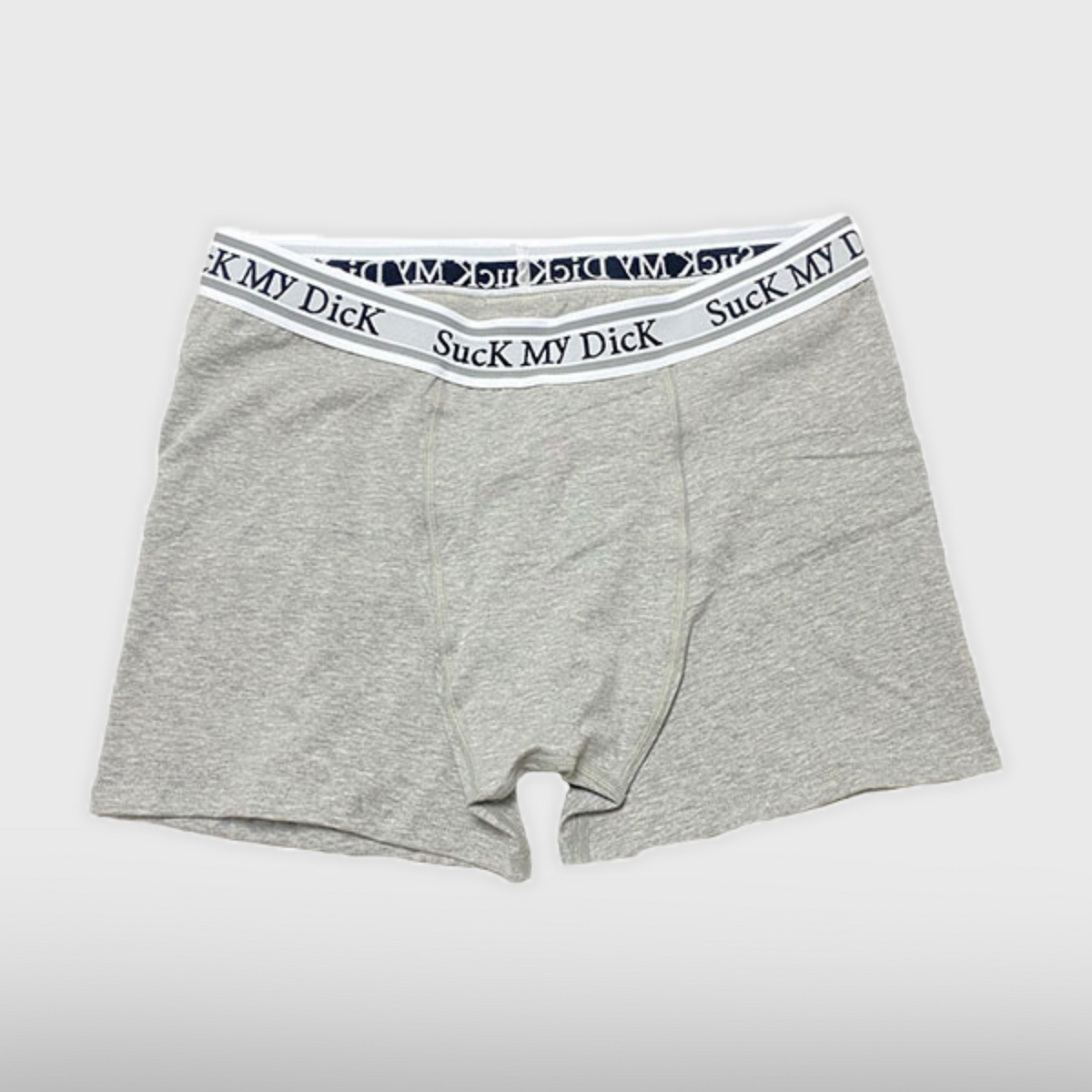 Heather grey Suck My Dick boxer briefs laid flat, front view with a white and grey waistband